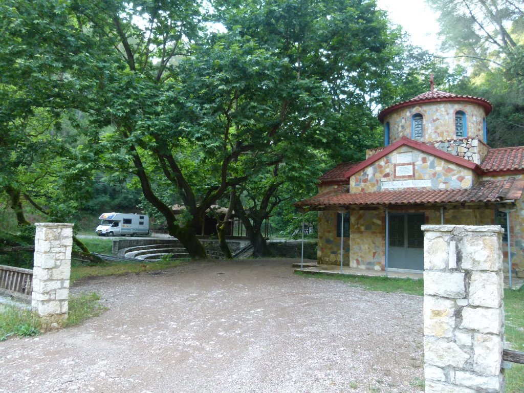 We are parked on a picnic area located across from the church. Between the two areas is a creek and water coming out from a spring.