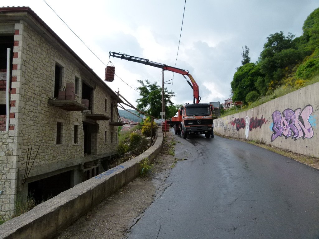 We had to stop for 10 minutes as the truck unloaded roof tile to the building site. He was very apologetic but there was no other way he could do it. One minute after he finished the rain came with a vengeance.