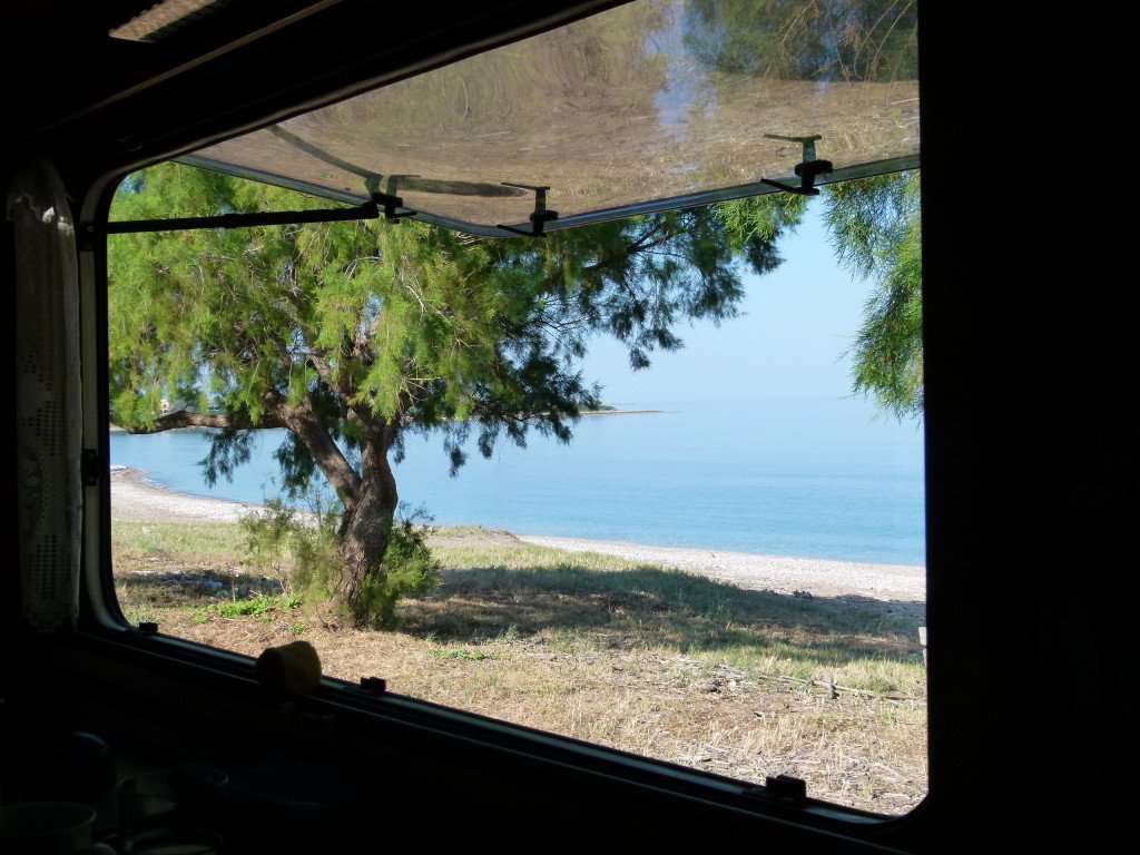 The view from our window. The water was clear and refreshing. We swam, snorkeled and relaxed here for three days along with many other motorhomers and locals.