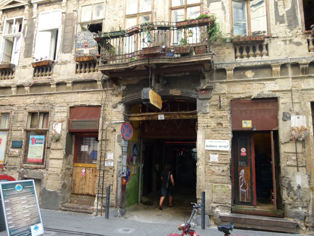 Szimpla Kert, situated in Kazinczy utca, one of the busiest party streets of downtown Budapest, is the mother of all ruin pubs. The interior, courtesy of contemporary artists, looks like as if it was put together from the selection of a second hand shop selling electronic devices, prehistoric toys, old bikes, and even vintage Russian cars.