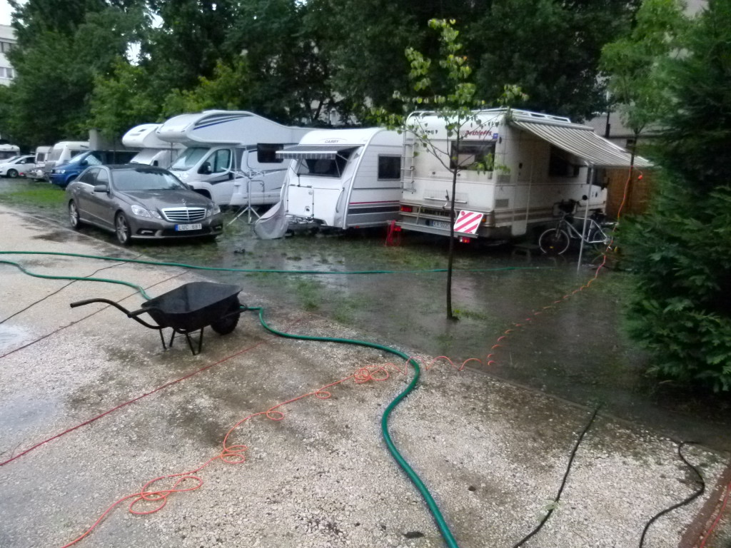 Haller camping after the rainstorm. Th hoses are being connected to pumps.