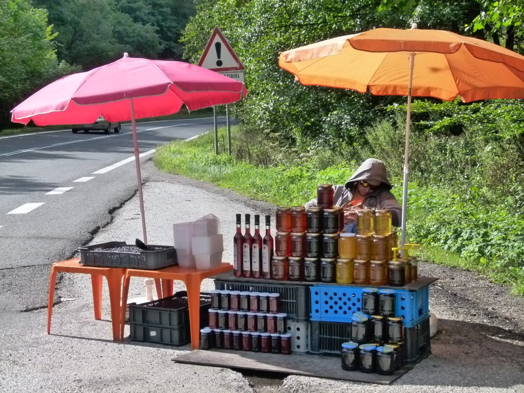 We stopped to buy some berries on the roadside. This lad was fast asleep and was shaken awake by another person waiting to be served.