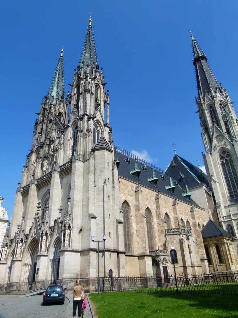 St Wenceslas Cathedral. The Prince Svatopluk commenced the construction of the Cathedral in 1104-1107. His son Wenceslas continued with the construction and handed over the unfinished building to Olomouc Bishop Jindřich Zdík before his death. The unfinished building was consecrated in 1131. It was completed in 1141 and it became an episcopal Church. The original three-nave Romanesque basilica has undergone numerous modifications and reconstructions. The cathedral was completely rebuilt into a Gothic style after a fire in 1265.
