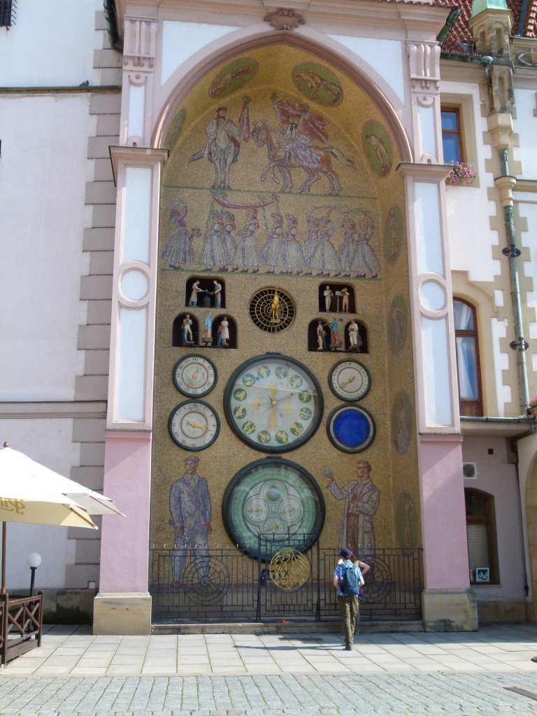 Astrological clock on the outside of the town hall. The present-day appearance of the Clock dates back to the 50s of the 20th Century and bears the traces of the former official aesthetic of socialist realism.