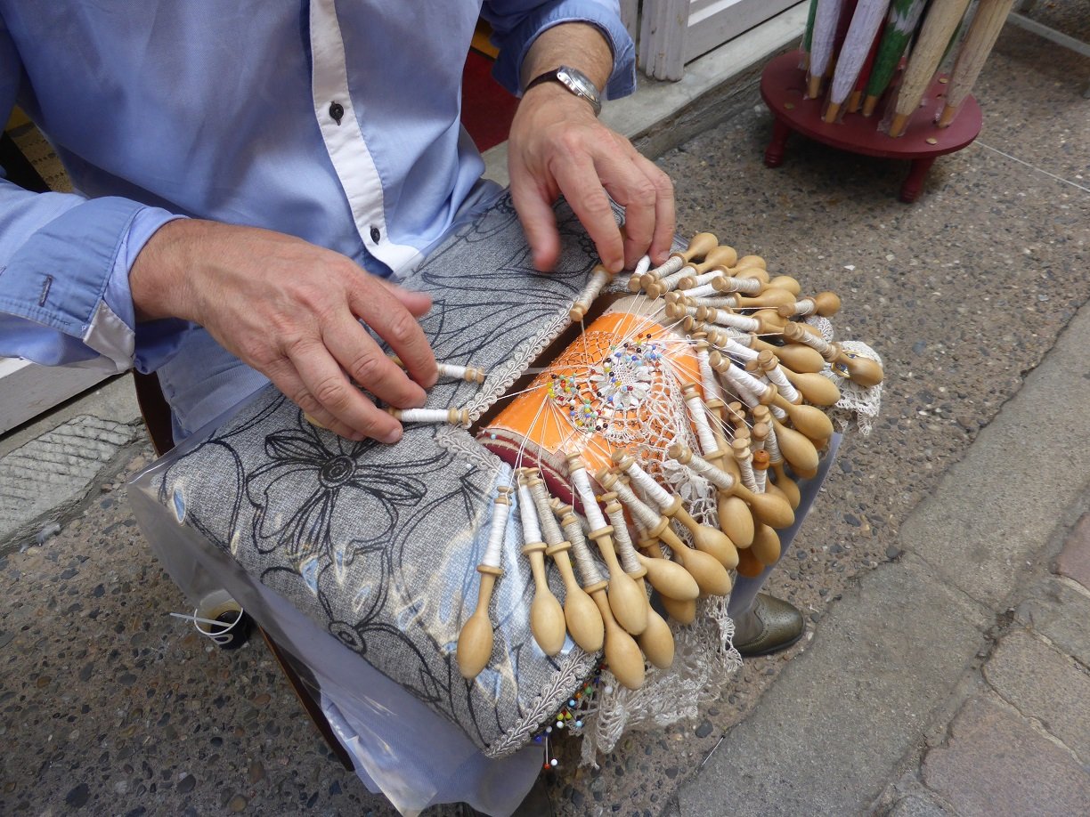 This was a man doing some lace work, he had been taught by his mother and had been doing it since 1998.