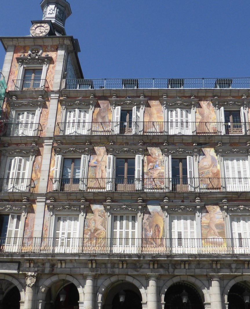 New artwork on the side of one of the buildings. Art students painted them, on many they forgot to paint in the clothes.