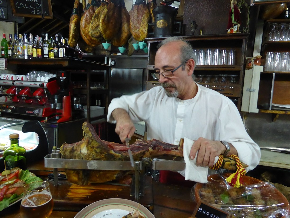 Tapas bar in Zaragoza. I asked him if I could take a photo. Of course he said, then he got me behind the bar and have a try at cutting the ham. I think I need a bit more practice.
