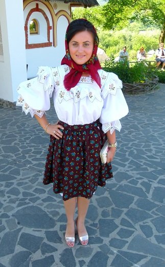 It was Sunday and the people in Romania get dressed up to go to church.I asked her if she minded that I talk a photo. She seemed very pleased that I asked and even posed with her hand on her hip.