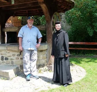 This friendly nun was at a monastery Romania. She spoke excellent English and was very informative, she showed me how the well worked and I gave it a try.