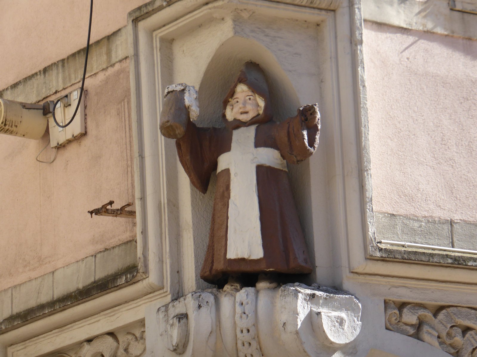This is suppose to be a monk with some beer ?? On the wall where the original bakers shop was in Thionville