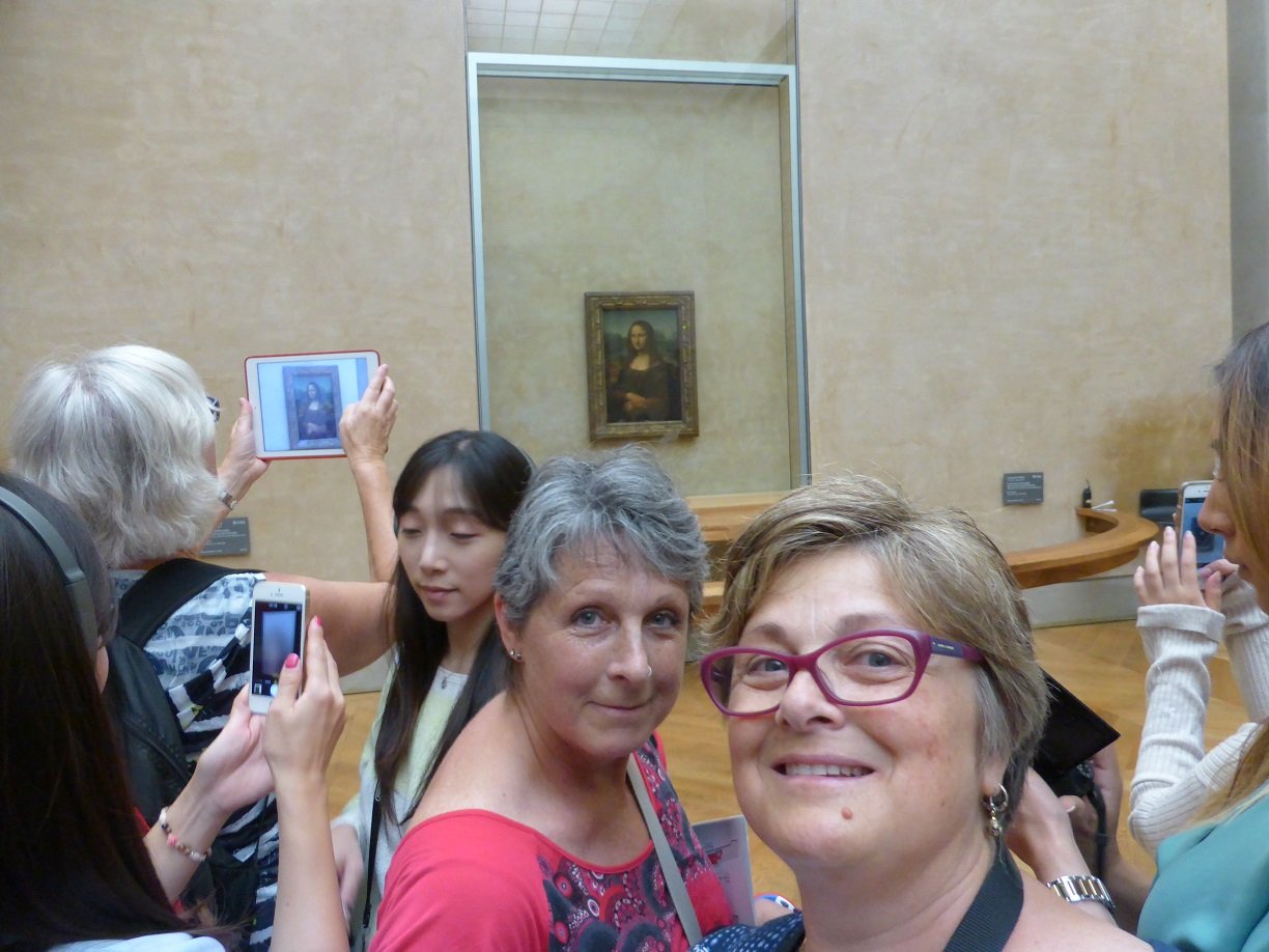 Jenny and Lori by the Mona Lisa. Crazy busy there, not really a place to admire this great painting.