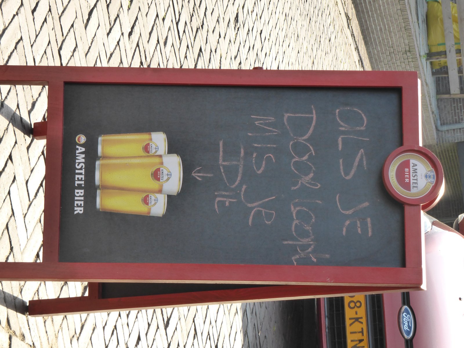 The sign translated says. If you walk on by this is what you missed. We had to stop and have a beer.