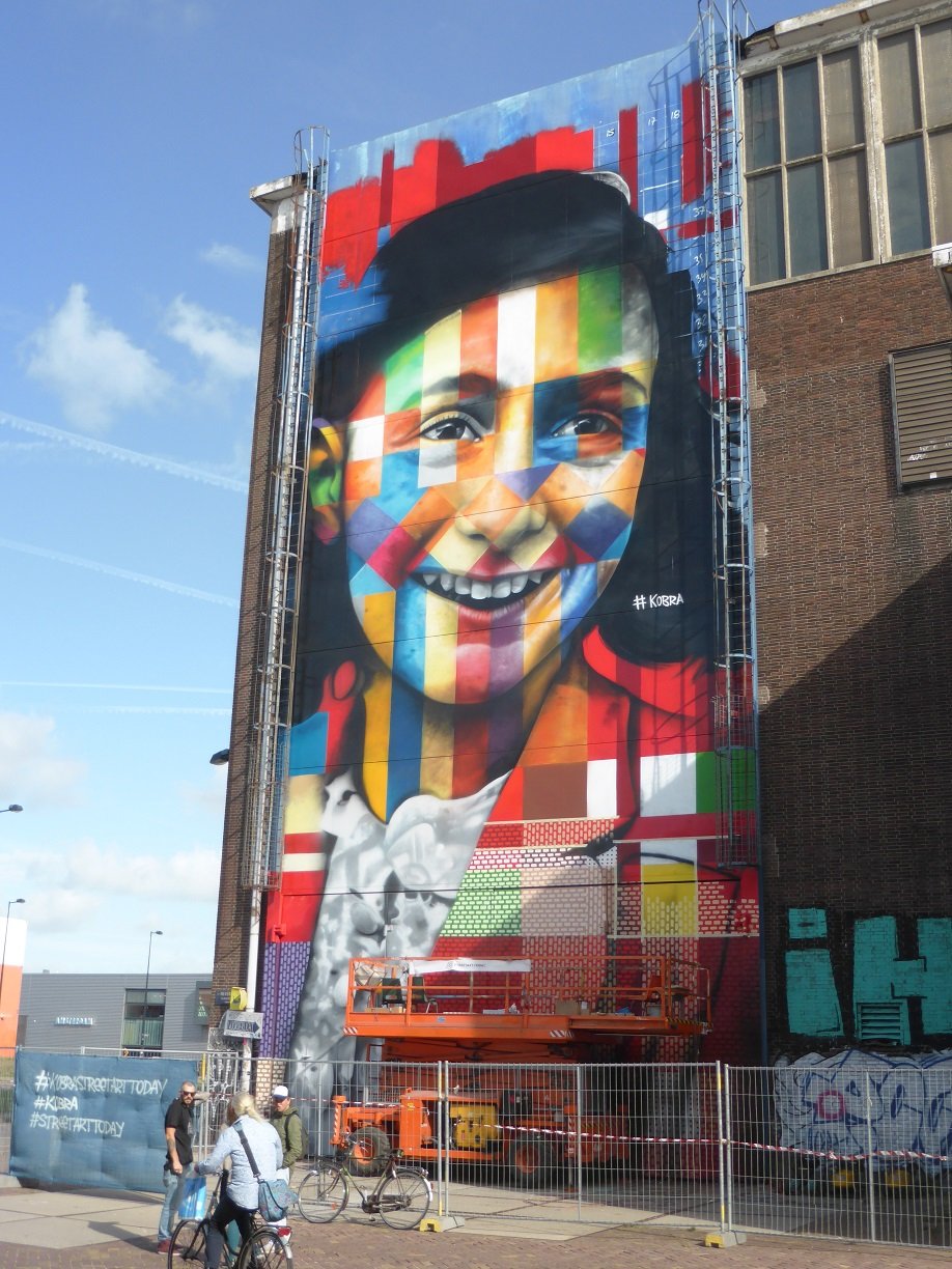 Anne Frank artwork still being finished off. It is being done by Eduard Kobra with some helpers. you can see some other art pieces he has done on his website. http://eduardokobra.com/